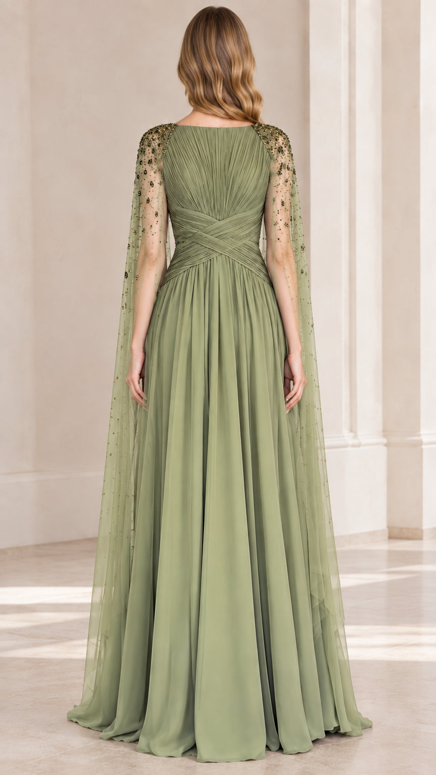 Back view of sage green floor-length evening gown with draped cape
