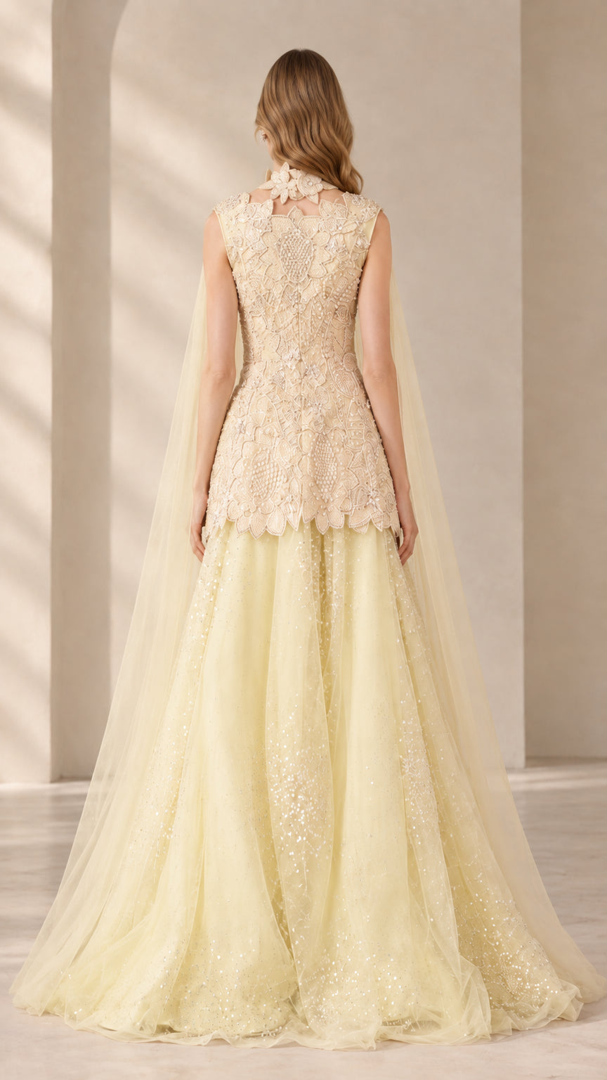 Back view of Champagne Yellow peplum gown showing sheer tulle cape drape