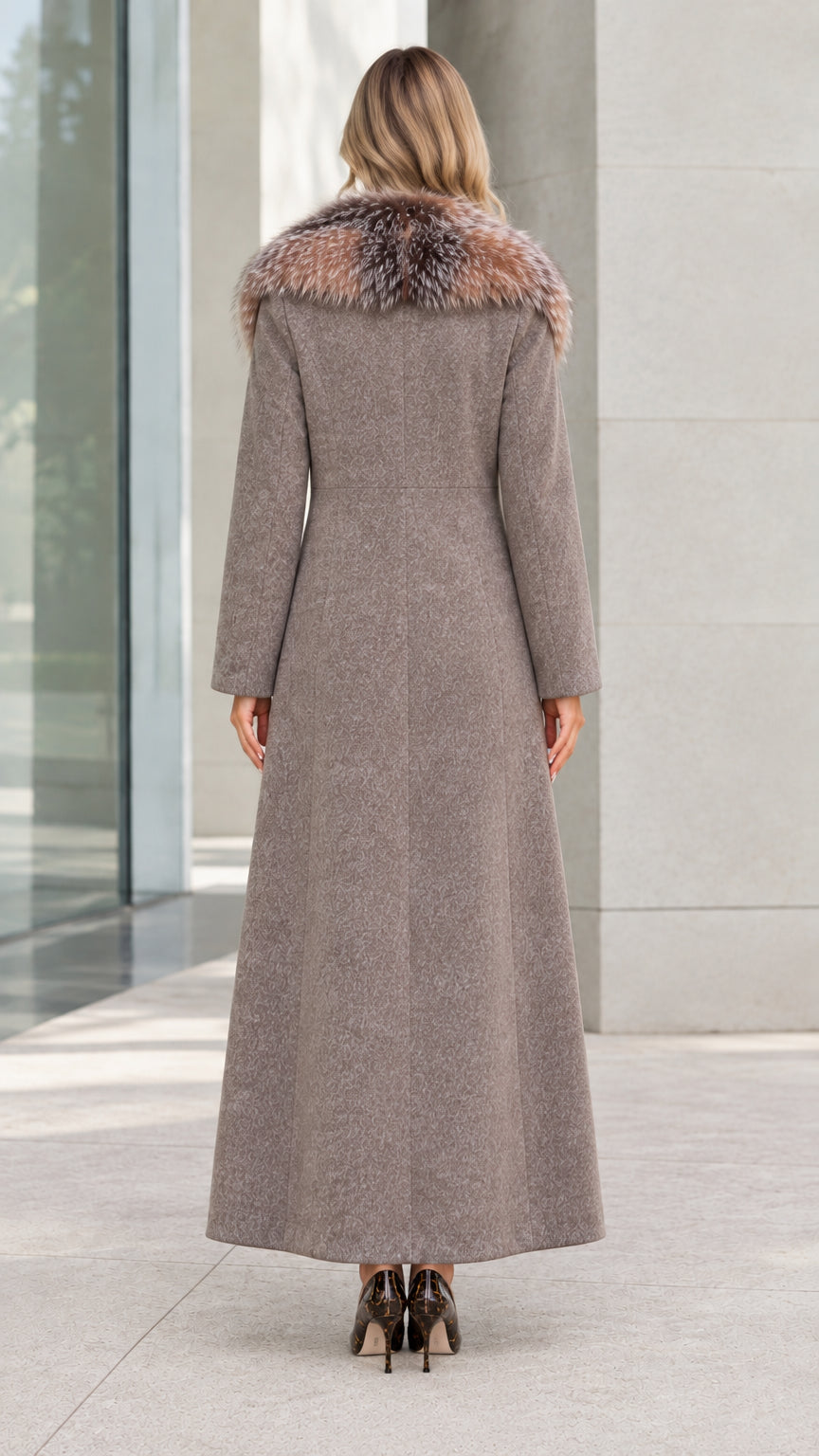 Back view of women's taupe structured maxi coat showing tailored fit and long hem