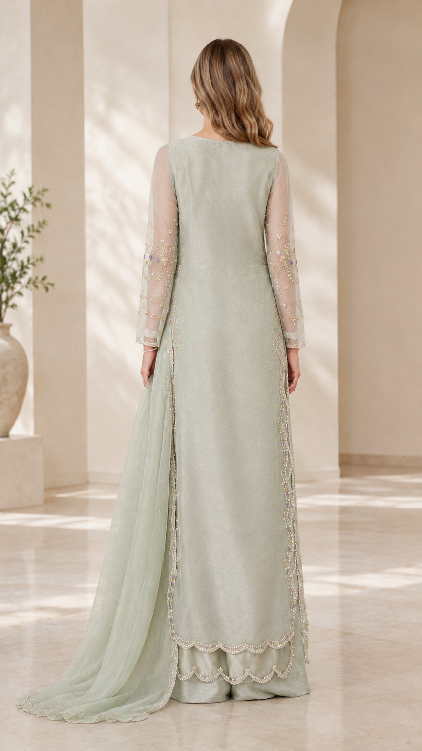 Back view of sage green long sheer embroidered tunic suit with draped dupatta