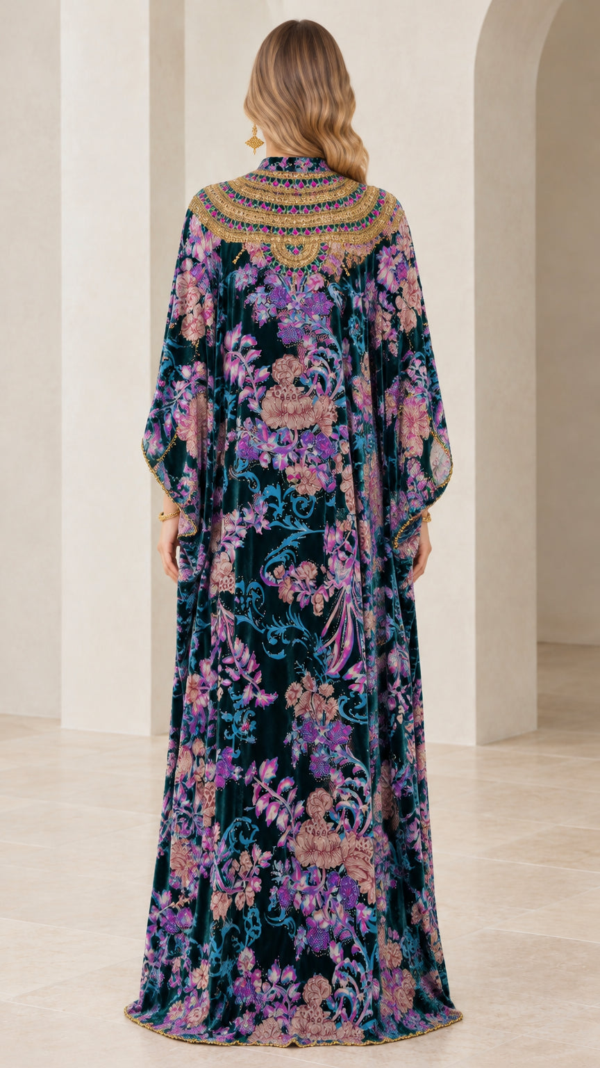 Back view of teal floral velvet maxi dress highlighting continuous print and drape