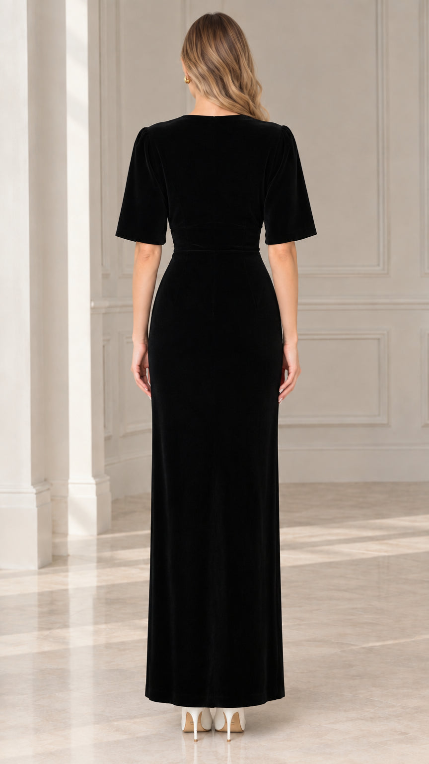 Back view of model in black velvet column maxi dress with back zipper