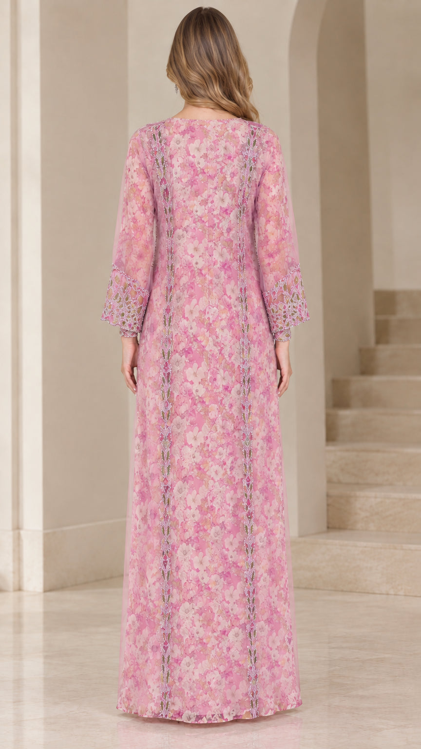 Back view of woman wearing floor-length pink floral kaftan dress