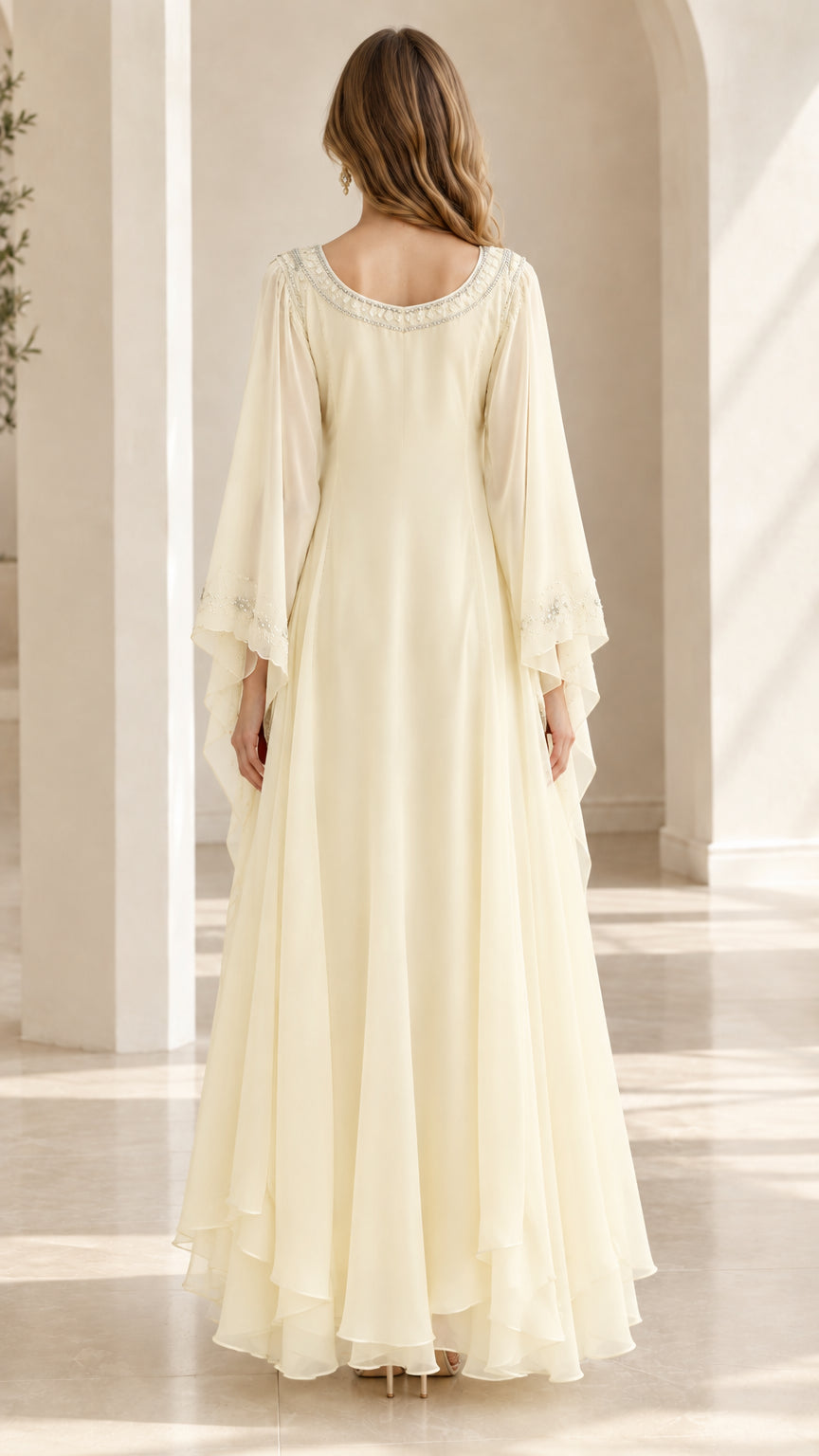 Back view of floor-length ivory chiffon maxi dress