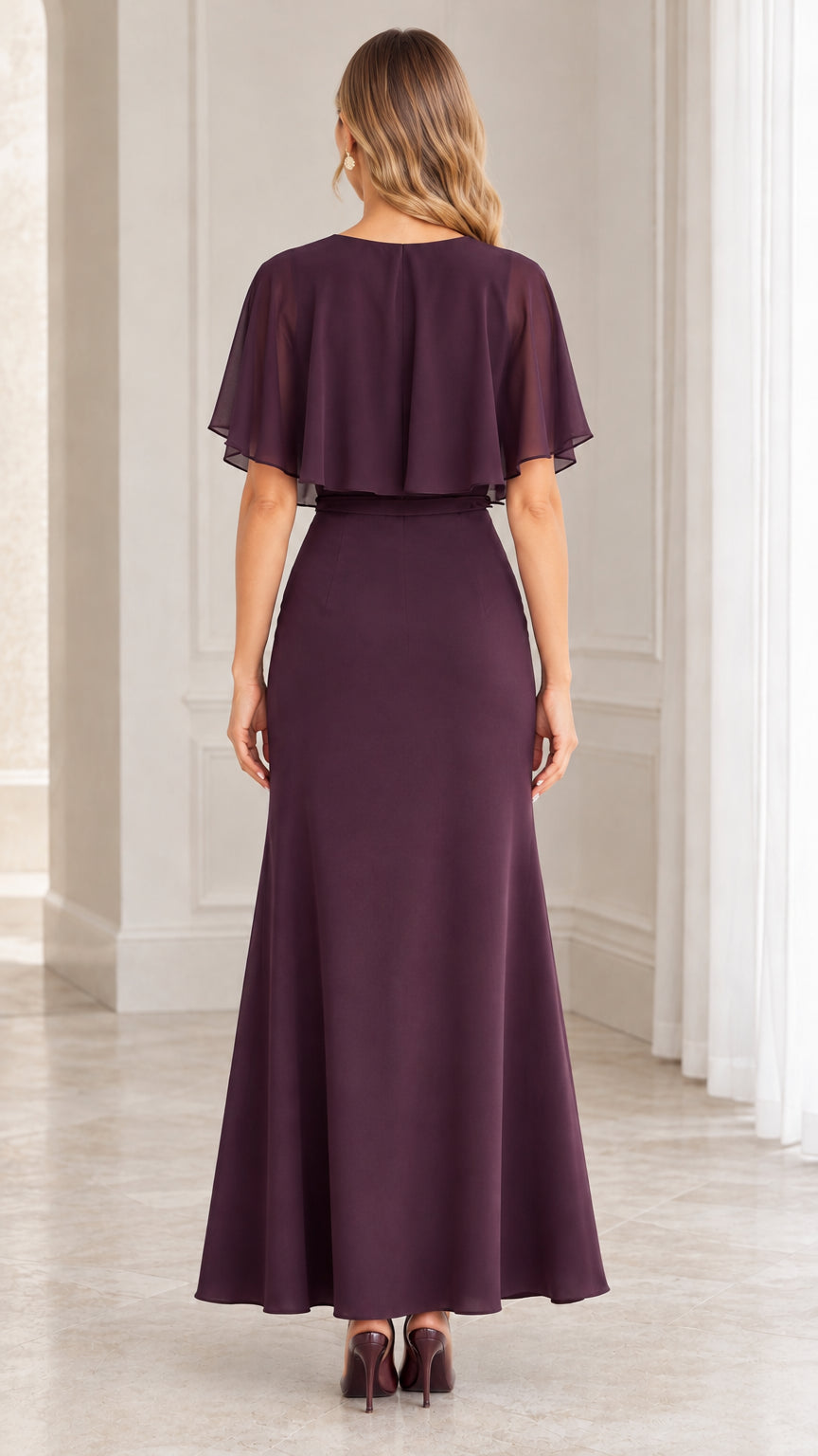 Back view of plum chiffon maxi dress showing the flutter capelet overlay