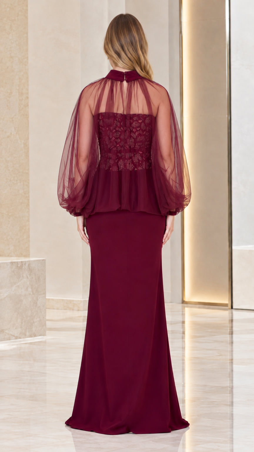 Back view of burgundy high neck evening dress showing sheer overlay and fitted skirt