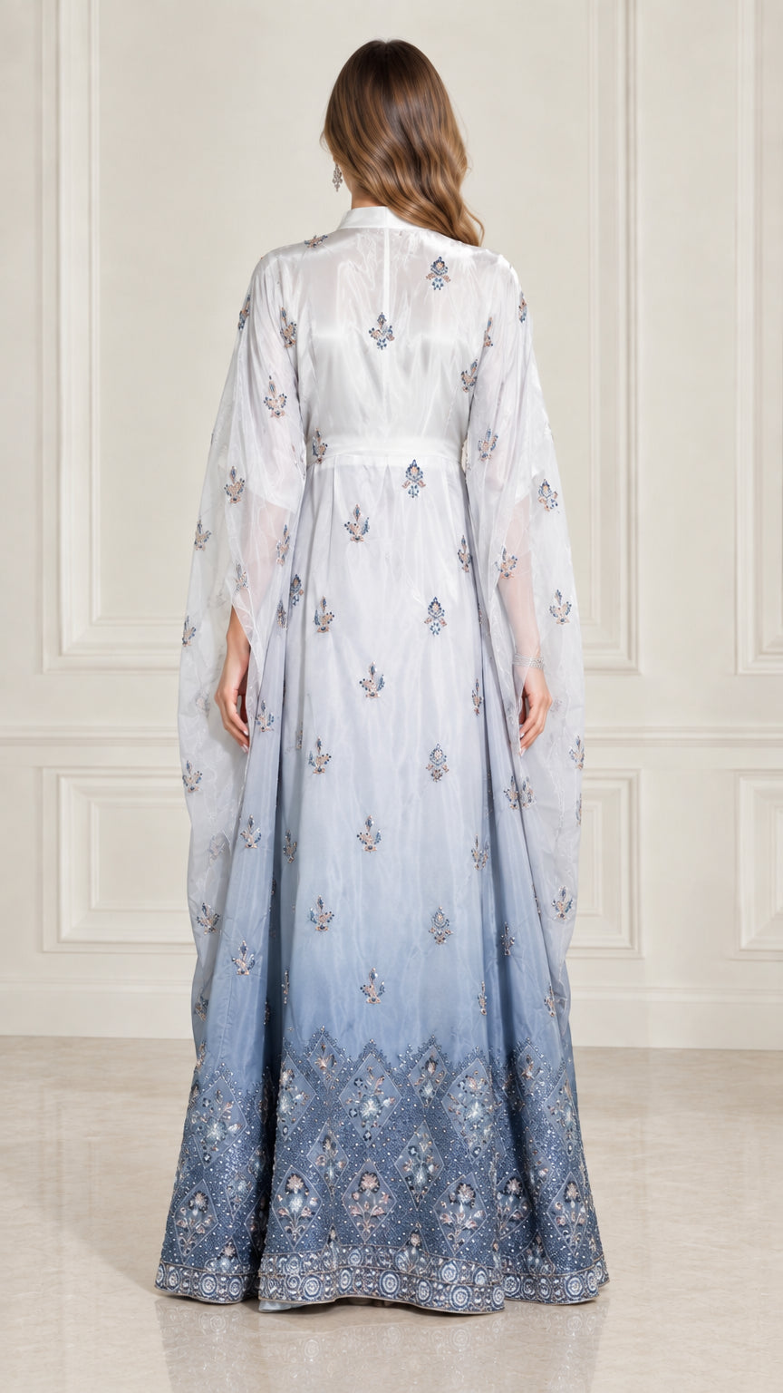 Back view of model in Ice Blue draped cape sleeve formal kaftan