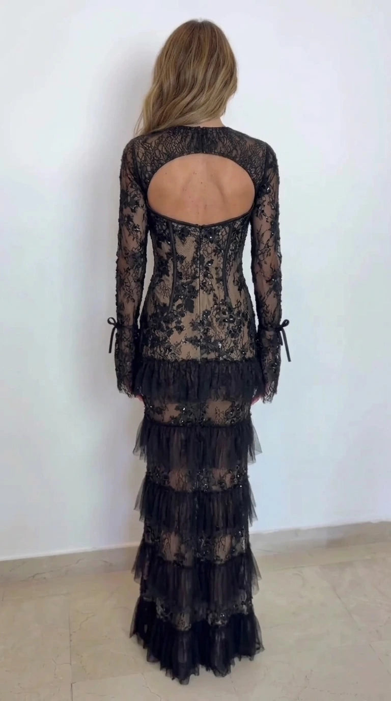 Back view of black lace corset dress showing open cutout back