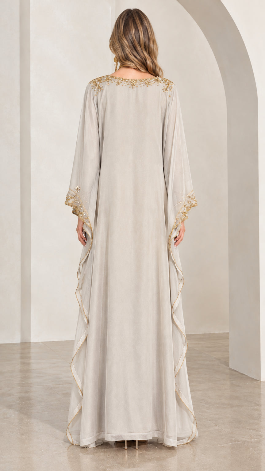 Back full-length view of silver grey kaftan dress showing draped silhouette