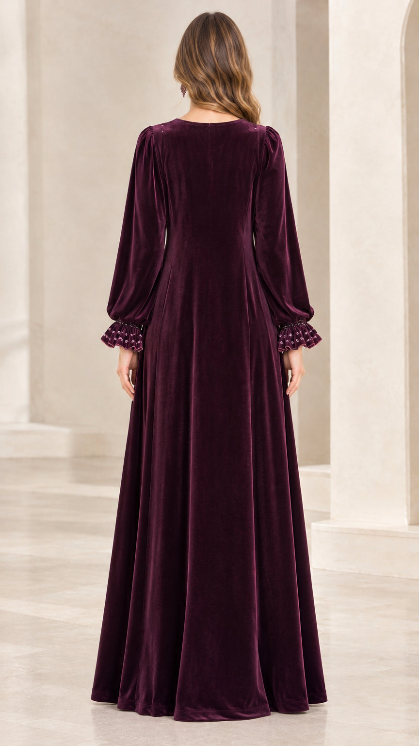 Back full-length view of woman in Plum velvet formal maxi dress