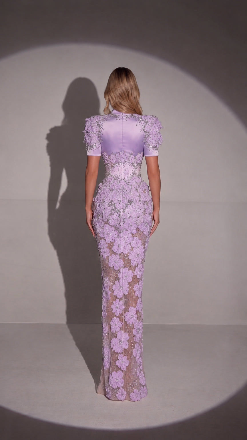 Back full-length view of lavender embellished formal evening gown