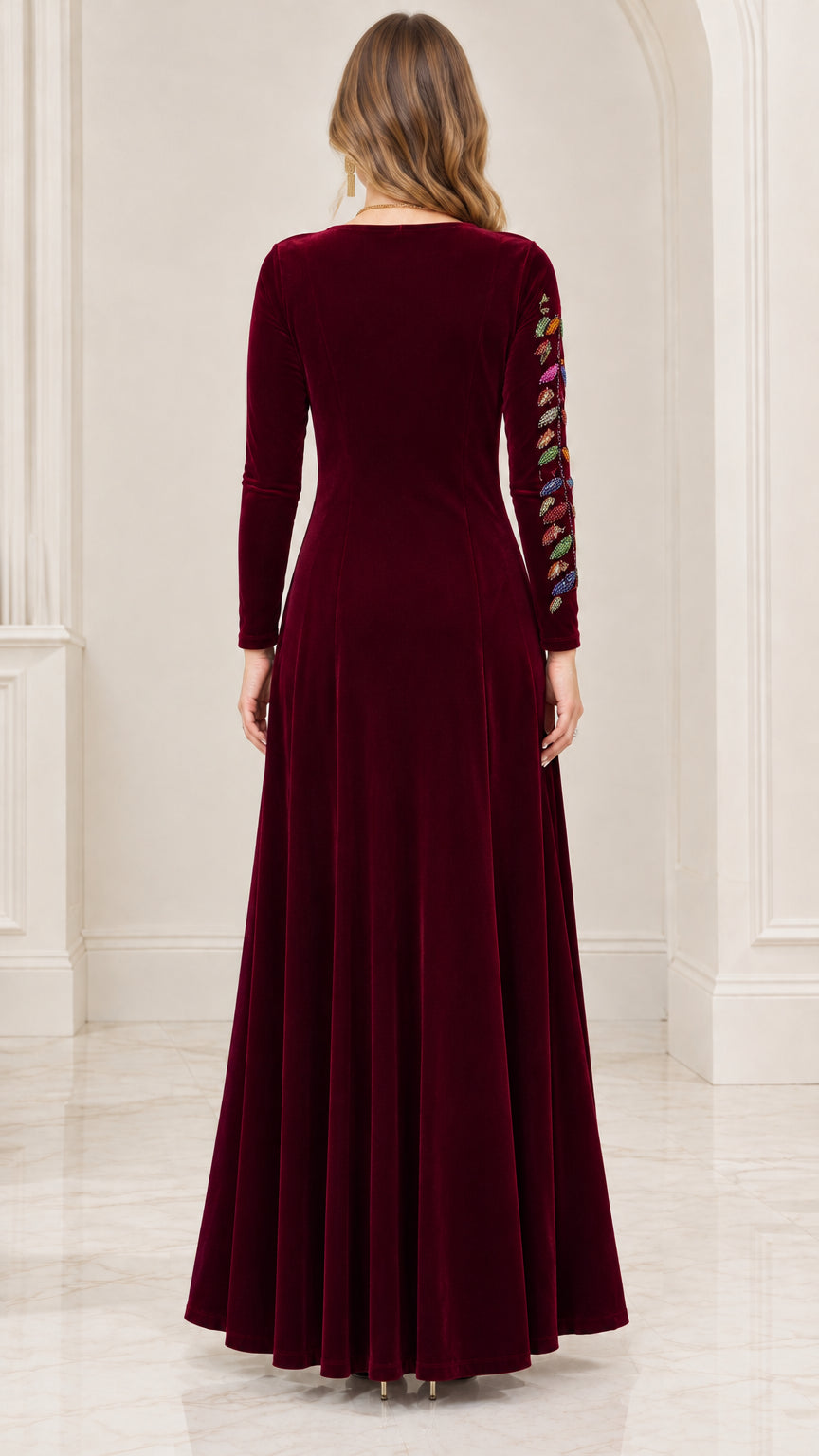 Back view of burgundy velvet maxi gown showing full-length skirt drape