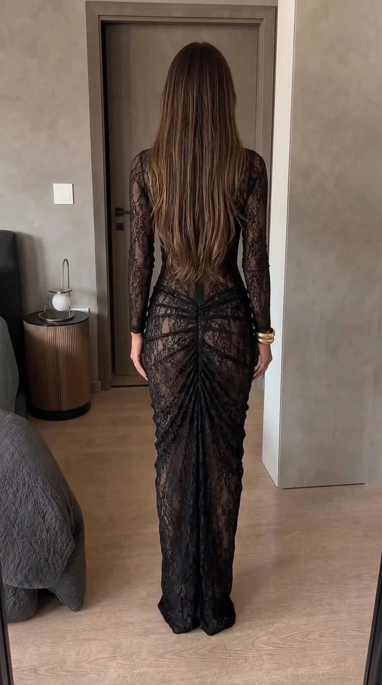 Back view of black long sleeve lace dress showing ruched detailing and zipper