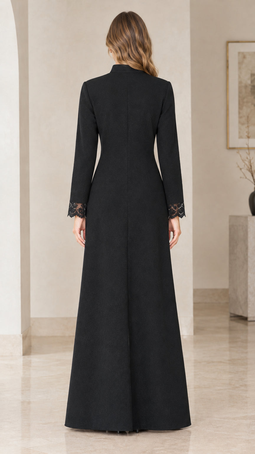 Back view of black floor-length A-line gown with stand collar
