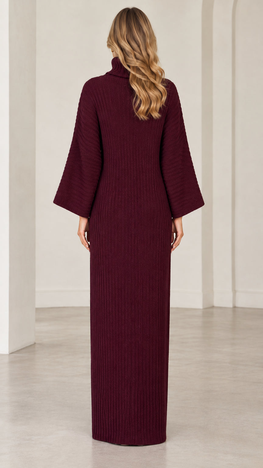 Back view of model wearing long burgundy turtleneck knit dress