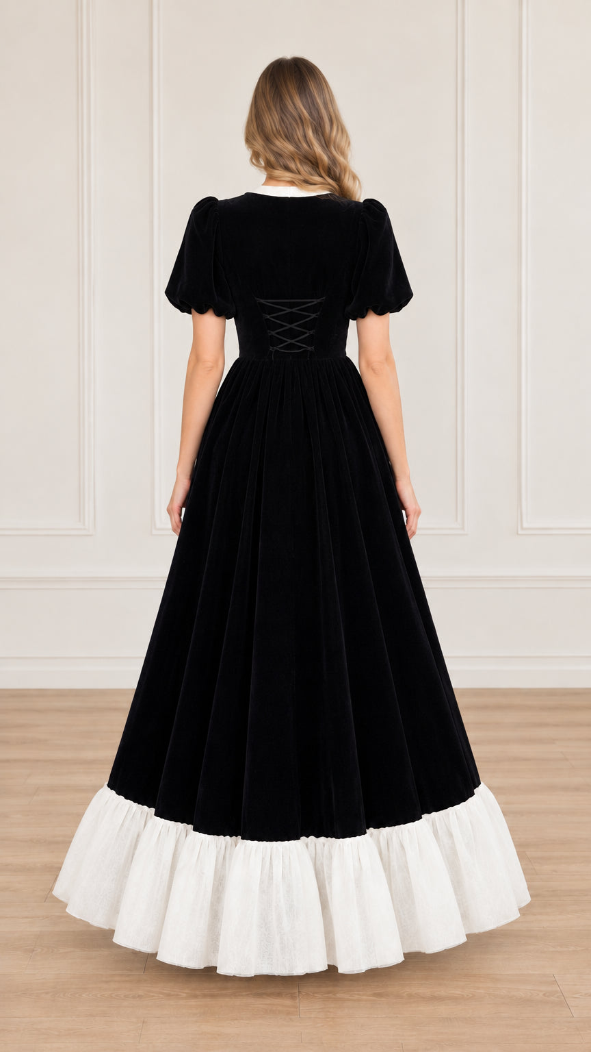 Back view of black velvet maxi dress showing corset lace-up waist detail