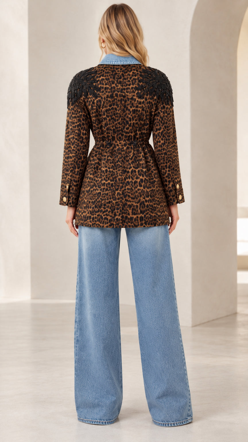 Back view of brown leopard jacket showing cinched waist silhouette