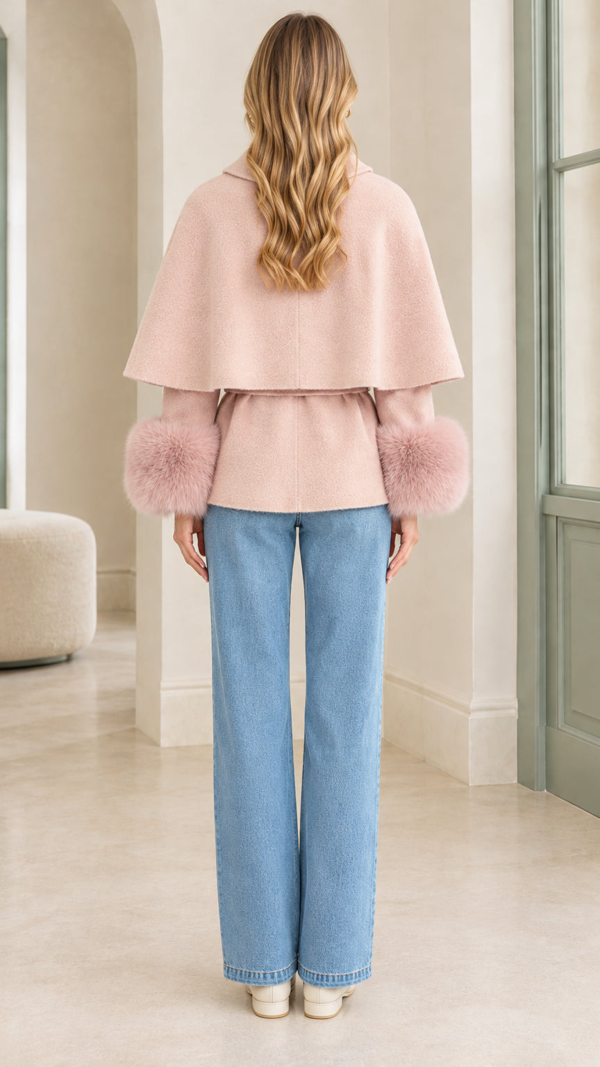 Back view of Blush Pink cape overlay jacket with belted waist