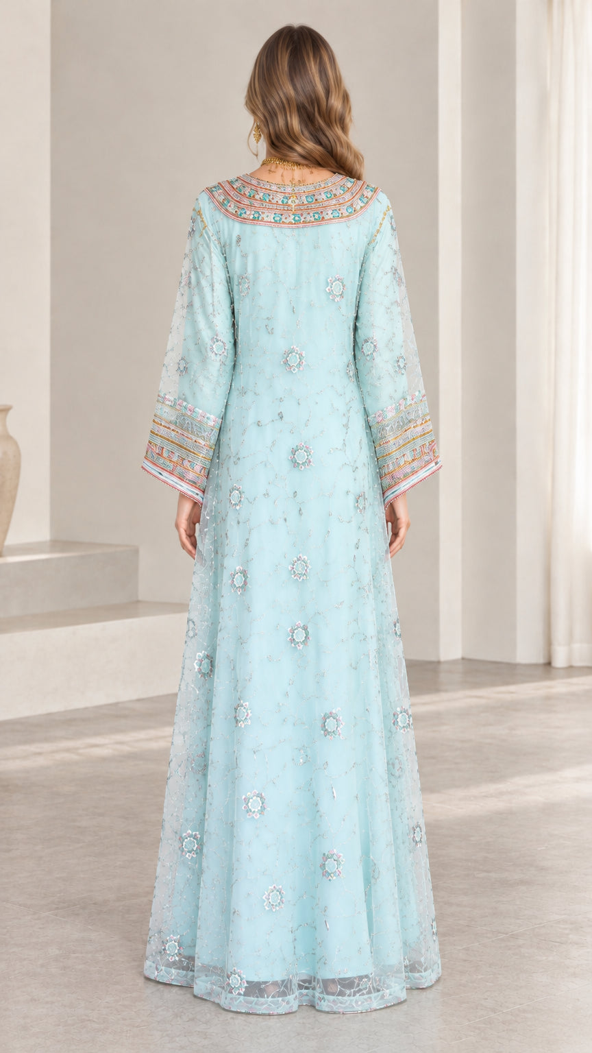 Back full-length view of woman wearing sky blue embroidered kaftan maxi dress