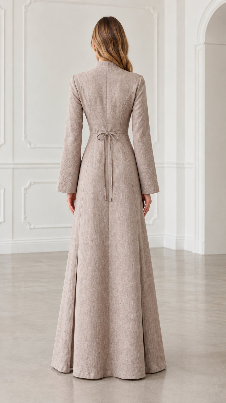 Back view of oatmeal maxi dress showing fitted waist and back tie detail
