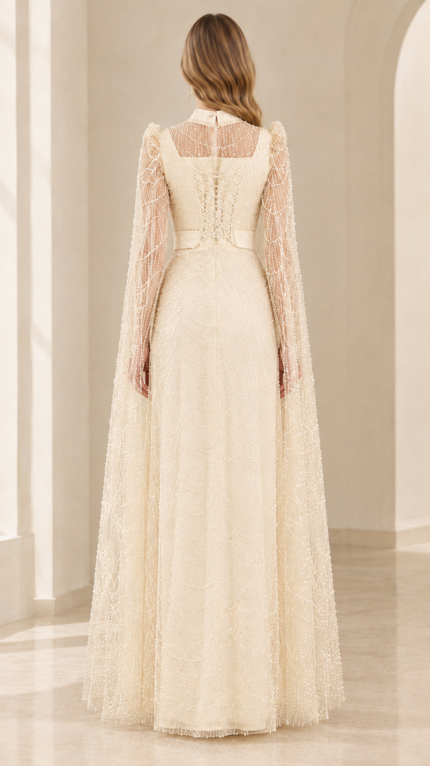 Back view of champagne embellished cape evening gown showing zipper detail
