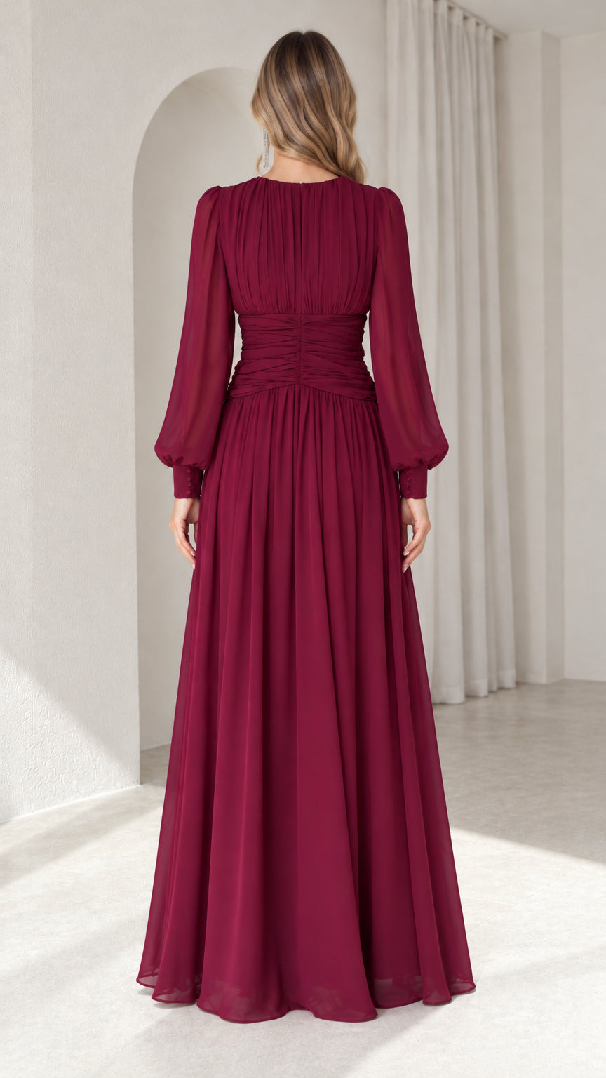 Back view of model in burgundy long sleeve evening dress showing zip closure and gathered skirt