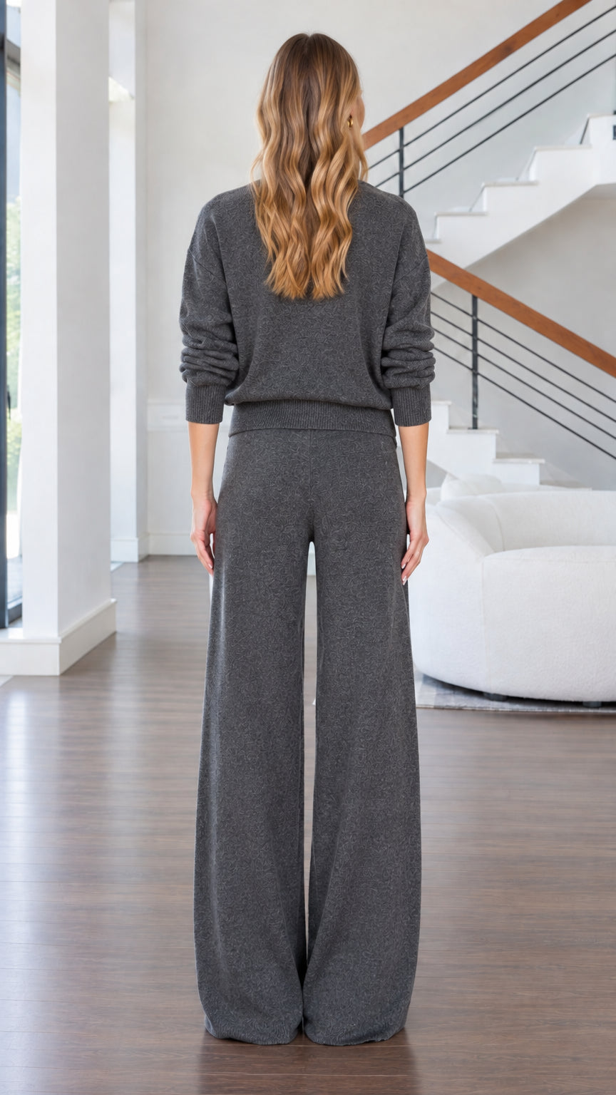 Back full-length view of woman in charcoal grey relaxed knit lounge set