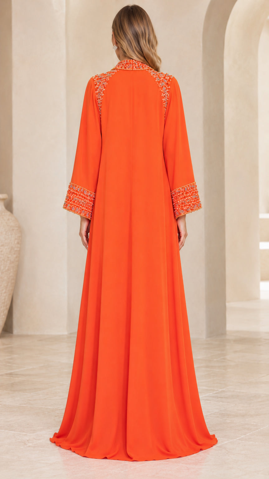 Back view of woman wearing orange floor-length modest kaftan gown
