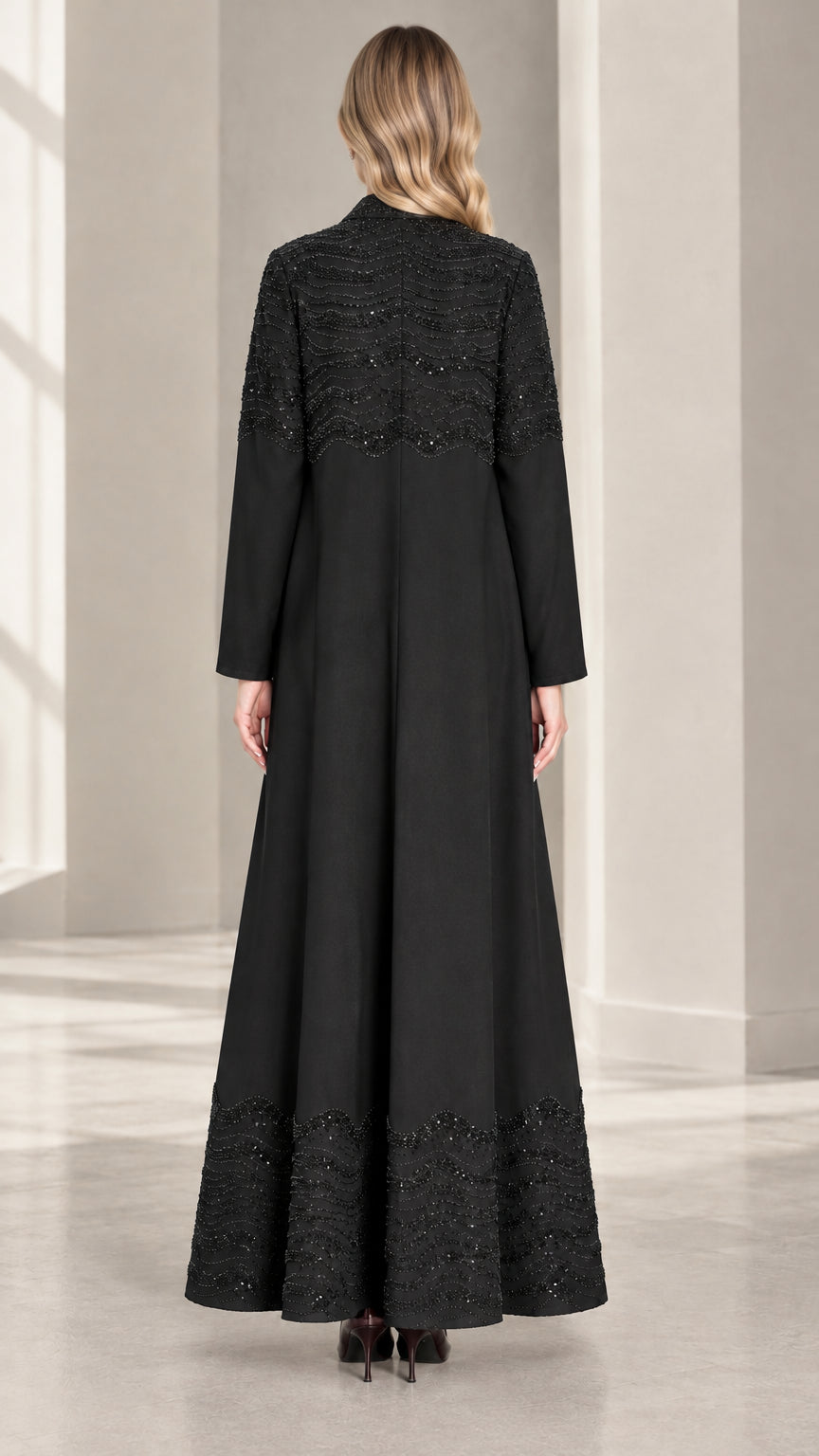 Back full-length view of Black sequined maxi dress and duster coat