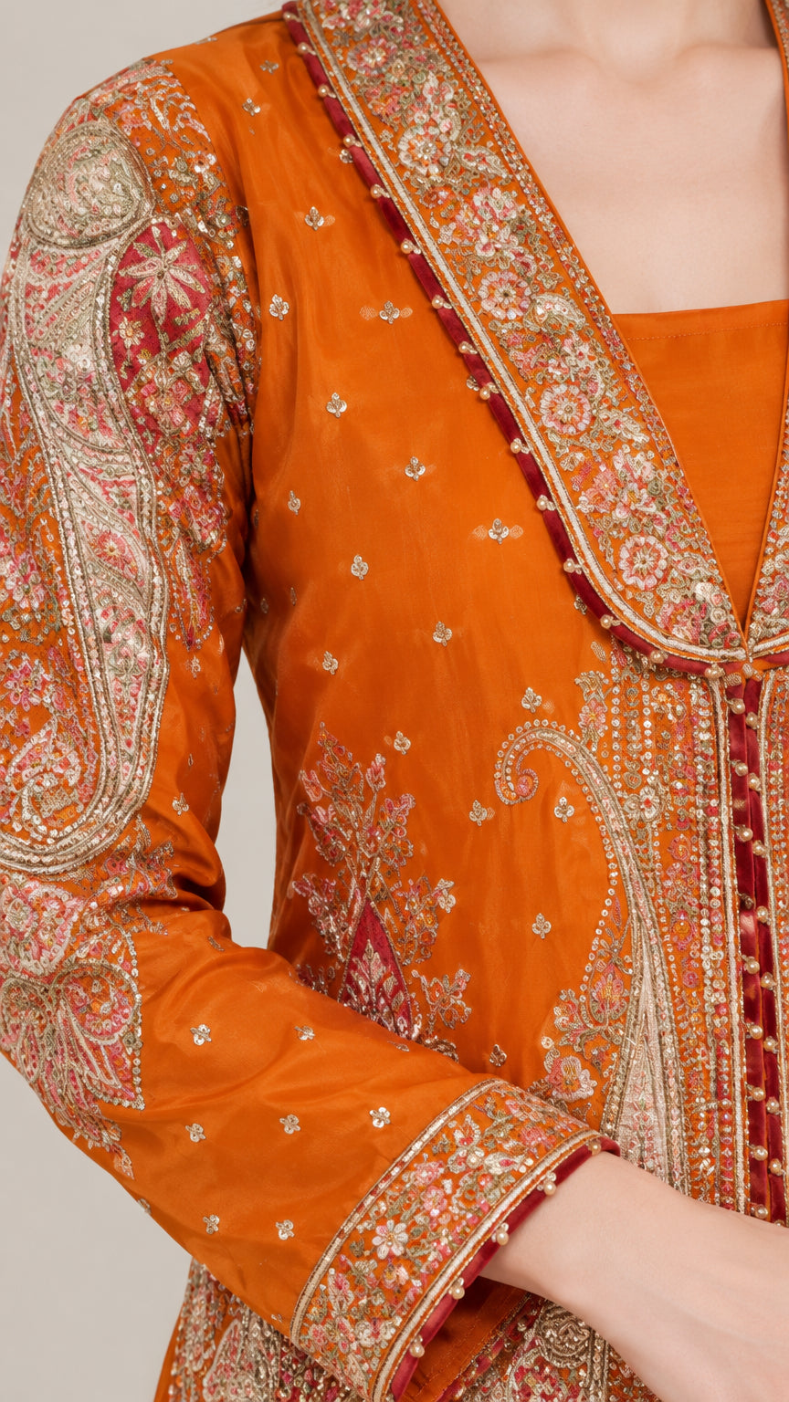 Close-up detail of ornate embroidery and lapel craftsmanship on the jacket