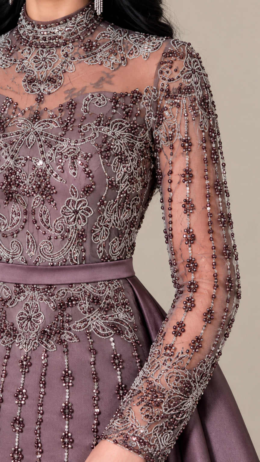 Close-up detail of sheer illusion neckline with intricate beading and sequins