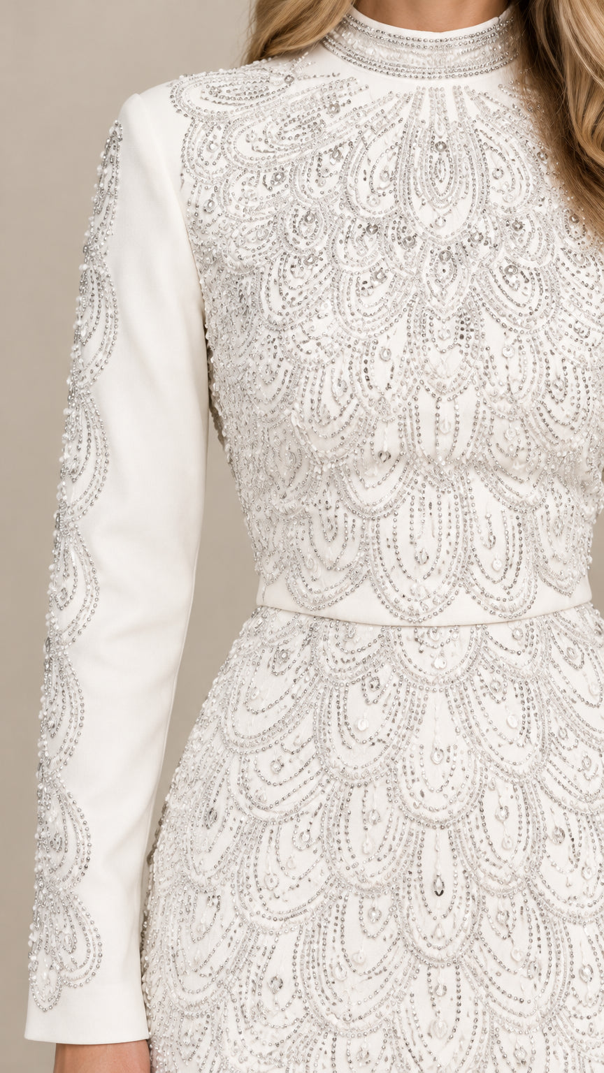 Close-up detail of intricate scalloped beading and mock neckline on White dress