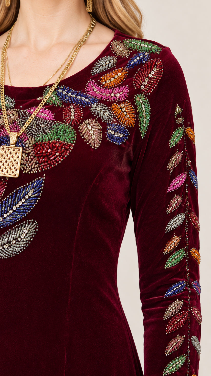 Close-up of multicolor beaded and embroidered botanical embellishment on velvet bodice
