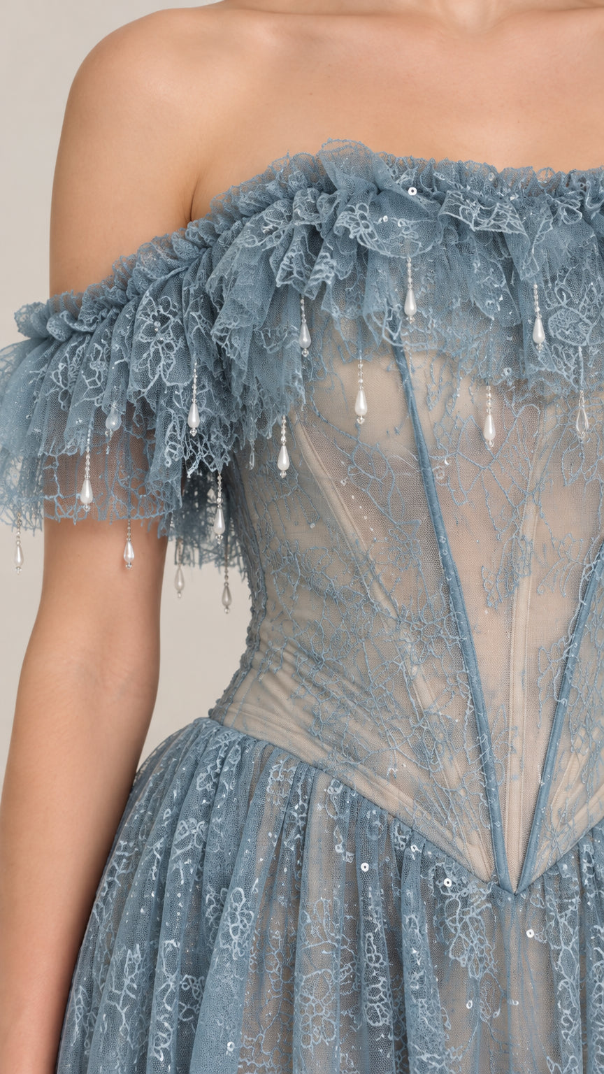 Close-up detail of ruffled off-the-shoulder neckline, drop beads, and corset boning
