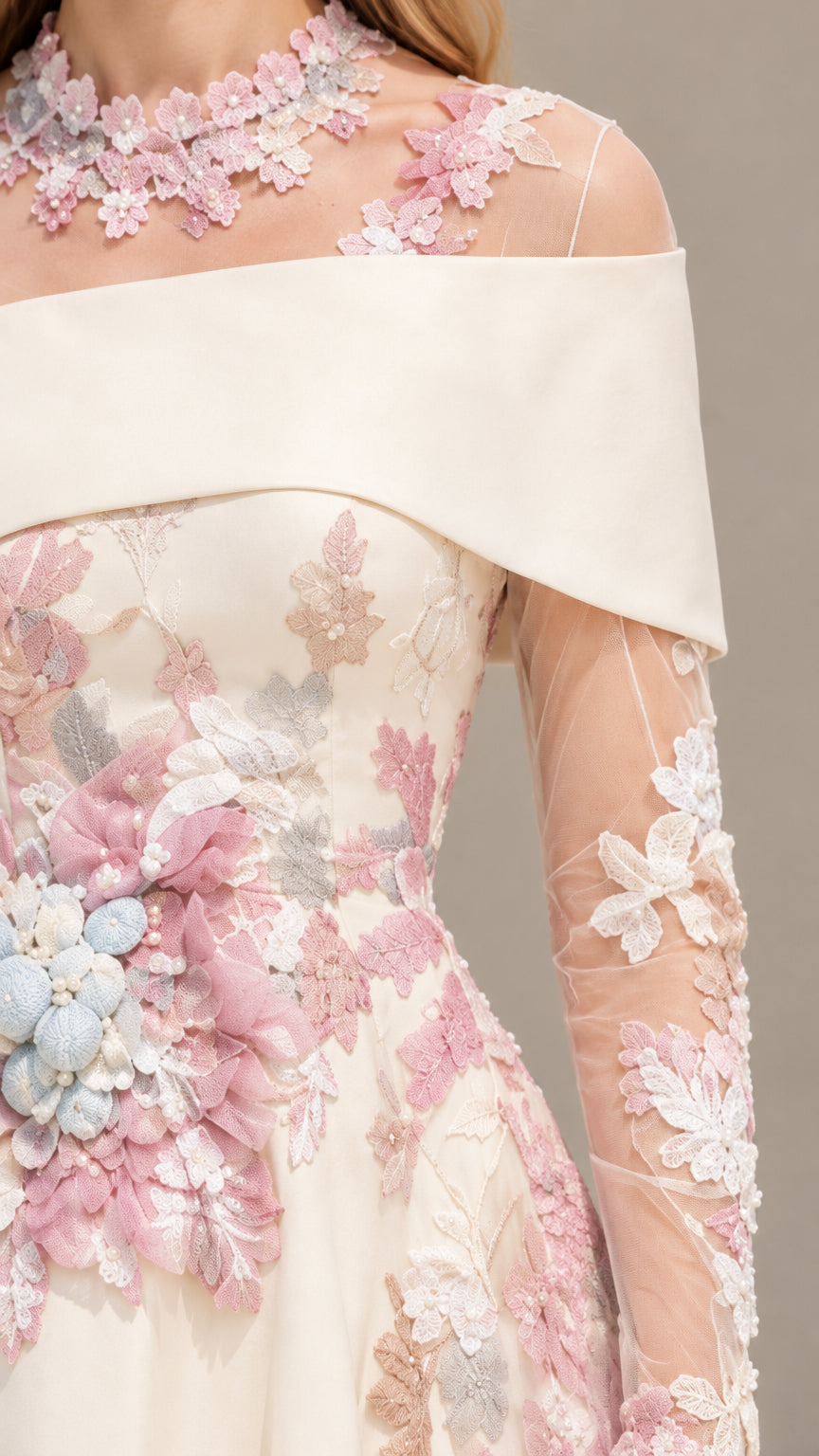 Close-up detail of 3D floral appliqués and folded off-shoulder collar