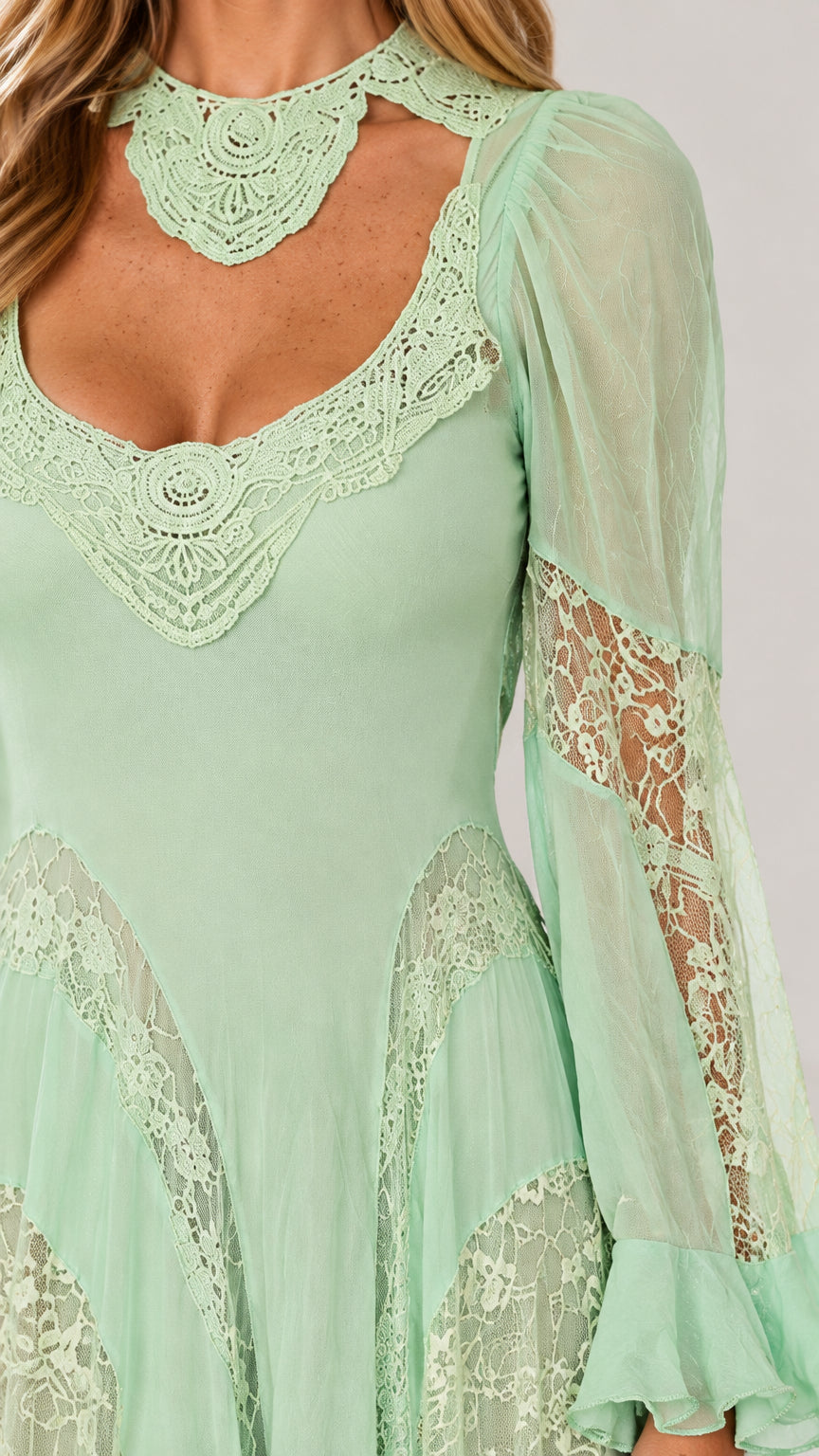 Close-up detail of lace choker collar, sweetheart cutout, and sheer sleeves