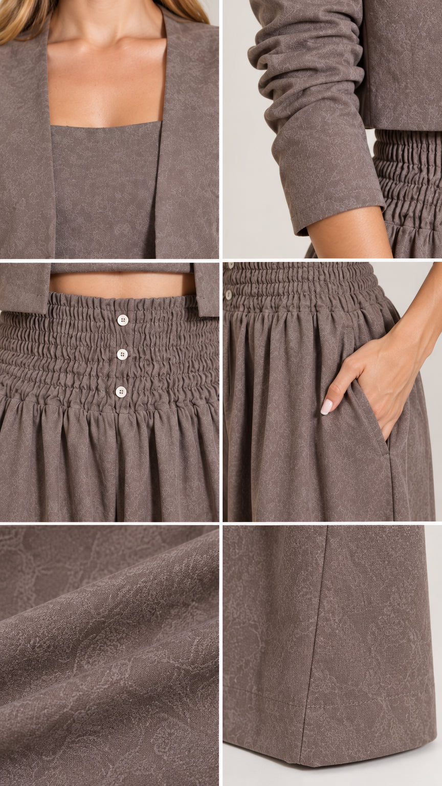 Close-up details of crop top neckline, smocked waistband with buttons, side pocket, and fabric texture