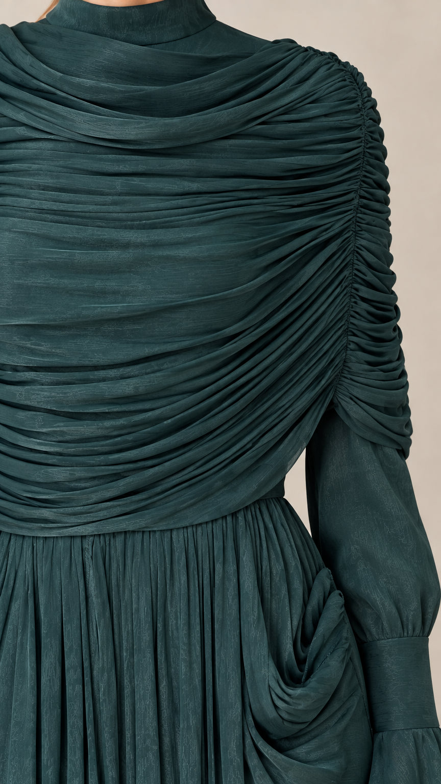 Close-up texture detail of ruched neckline and pleated bodice fabric in Emerald Green