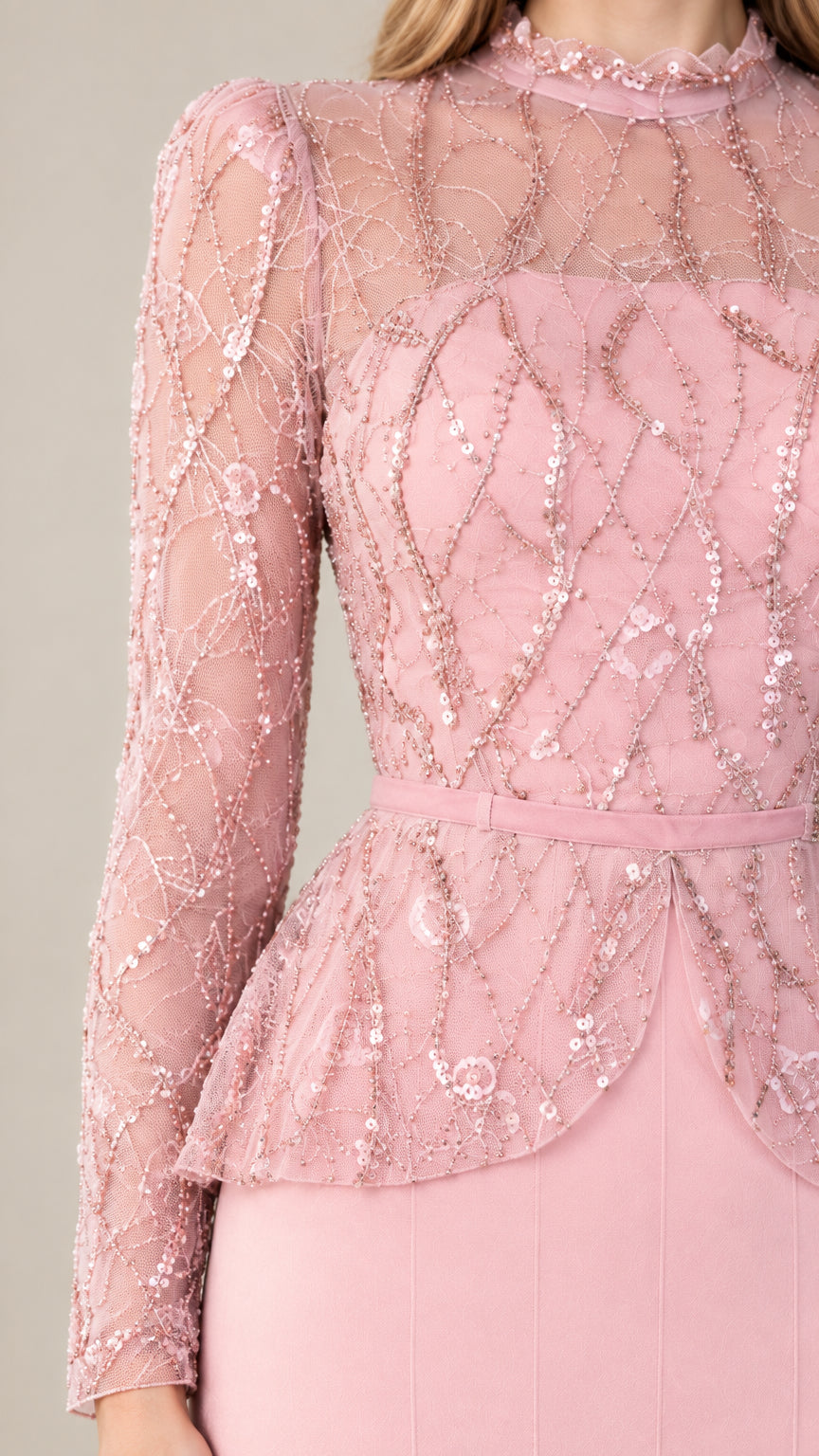 Close-up detail of blush pink sequin embroidered illusion bodice and peplum waist