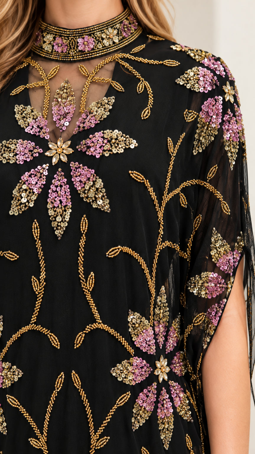 Close-up detail of sheer mock neck and sparkling floral sequin beadwork on black dress