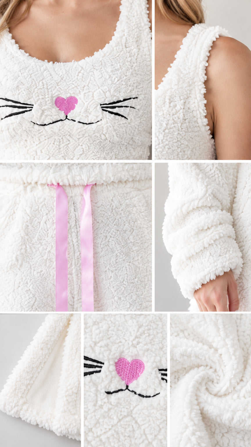 Close-up details of cat embroidery, drawstring waistband, and soft fleece texture
