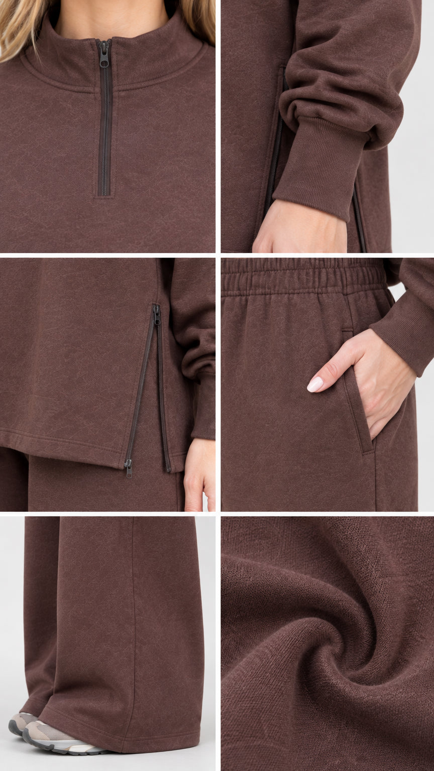 Close-up details of quarter-zip collar, side zipper hem, pocket, and soft fleece texture