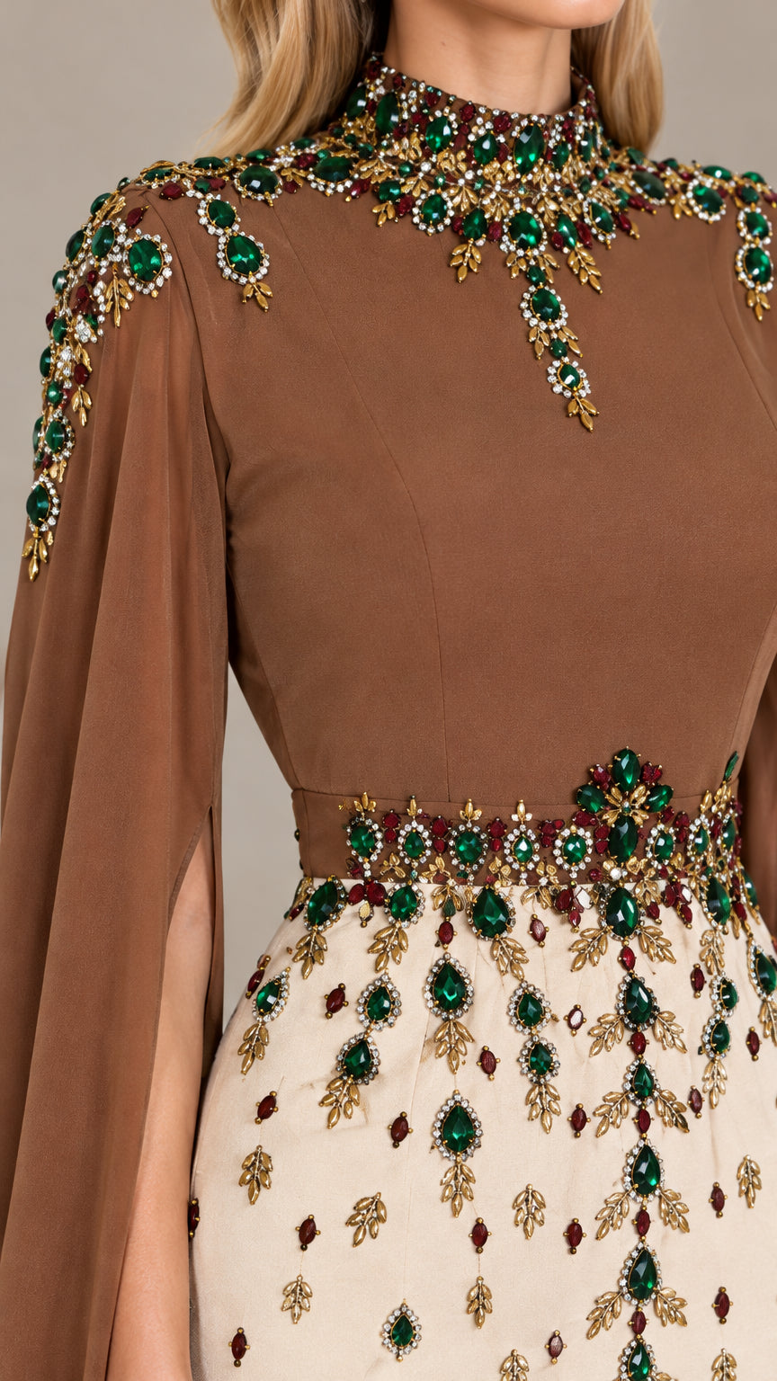 Close-up detail of ornate green crystal and gold bead embroidery on high neckline and waistband