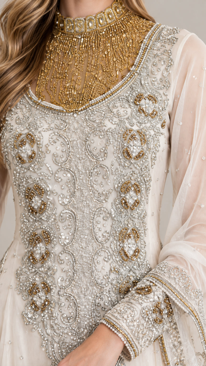 Close-up of gold beaded collar and intricate bodice embroidery on ivory gown