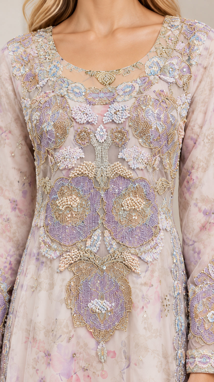 Close-up detail of ornate floral beading and embroidery on the bodice