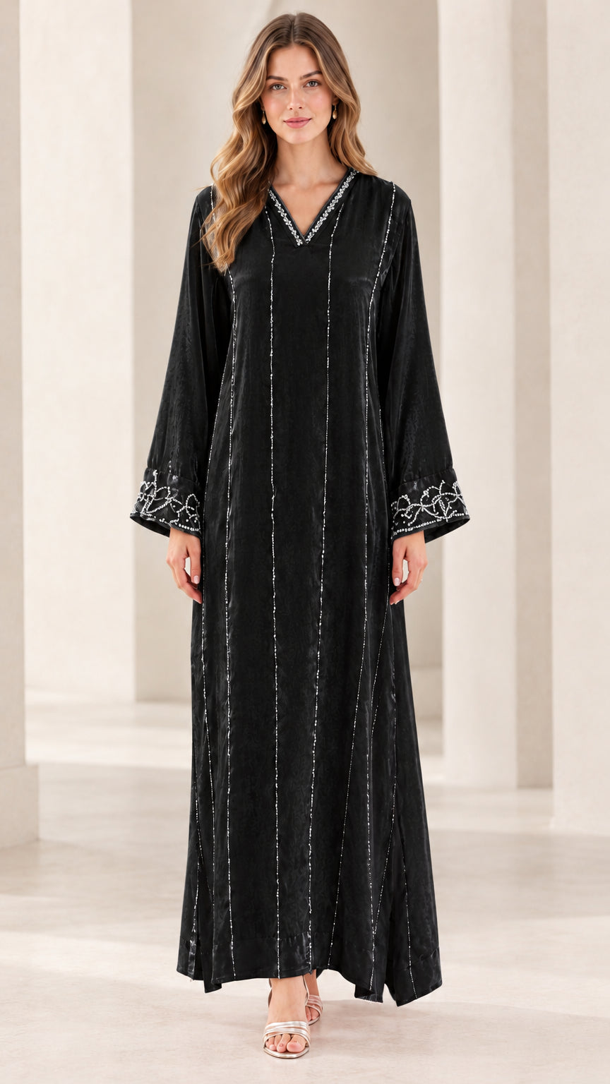 Front view of model wearing Black embellished velvet kaftan dress