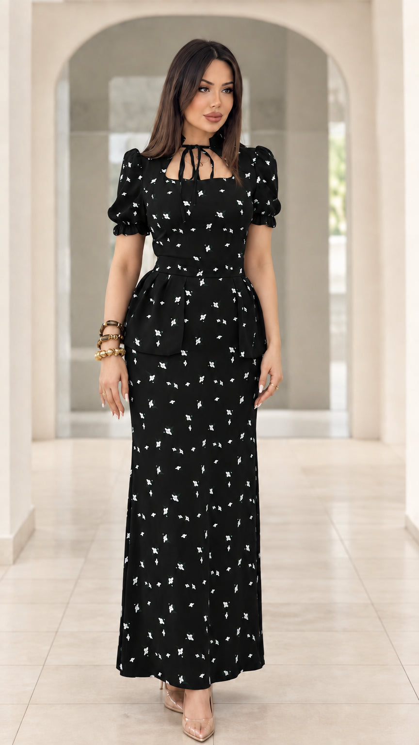 Model wearing black floral print peplum puff sleeve maxi dress