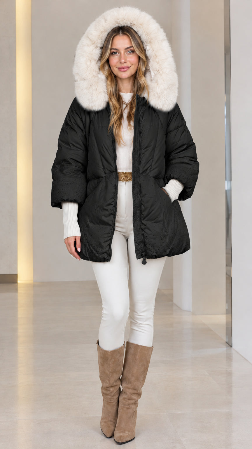 Front view of woman wearing black faux fur hooded quilted puffer coat