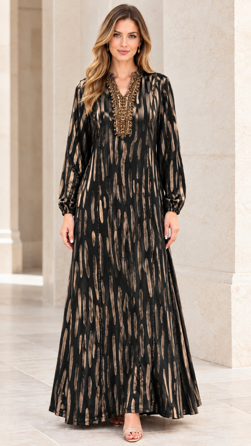 Front view of woman wearing Black and gold printed beaded maxi dress