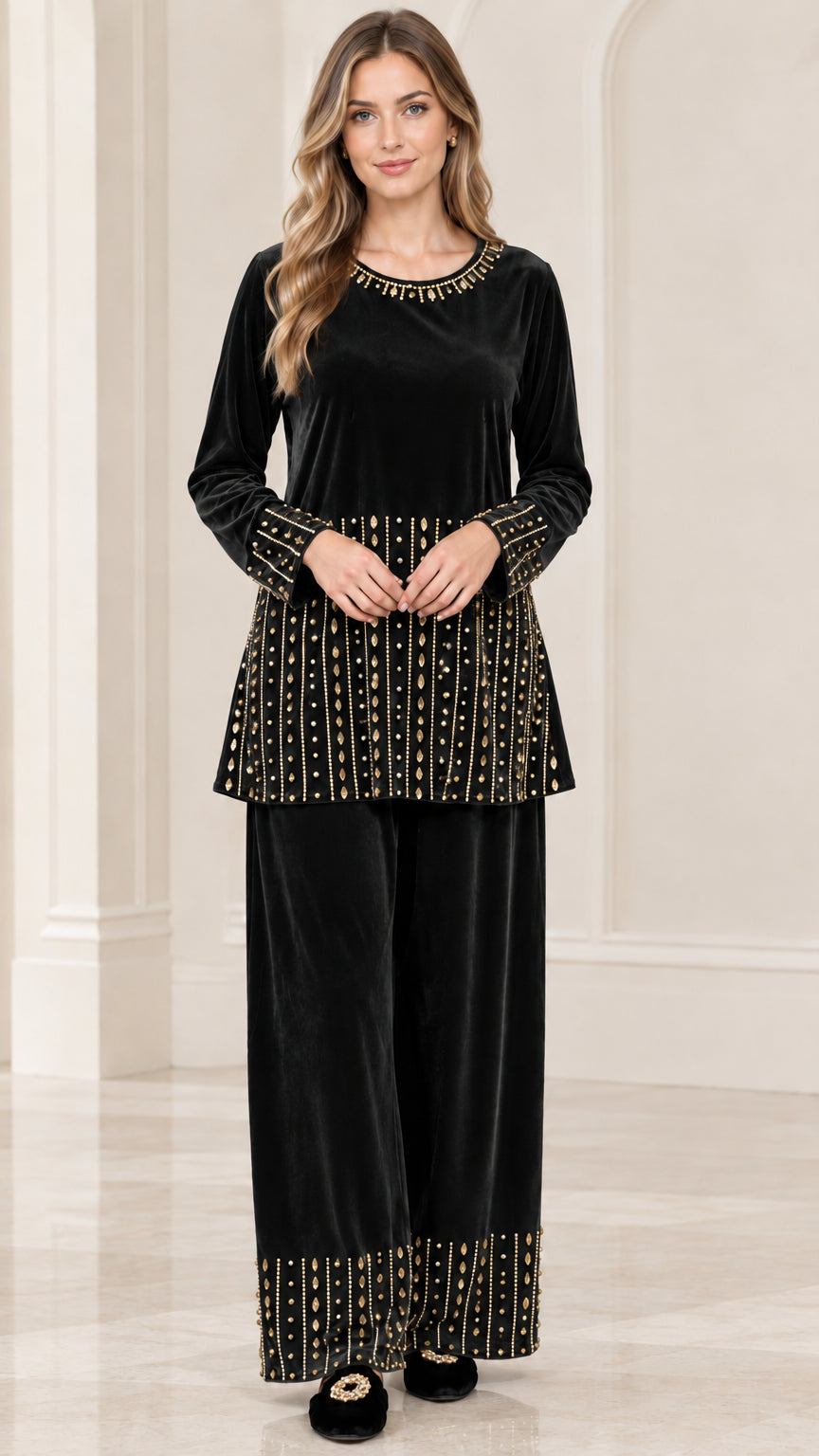 Front view of woman wearing black embellished velvet tunic and pants set